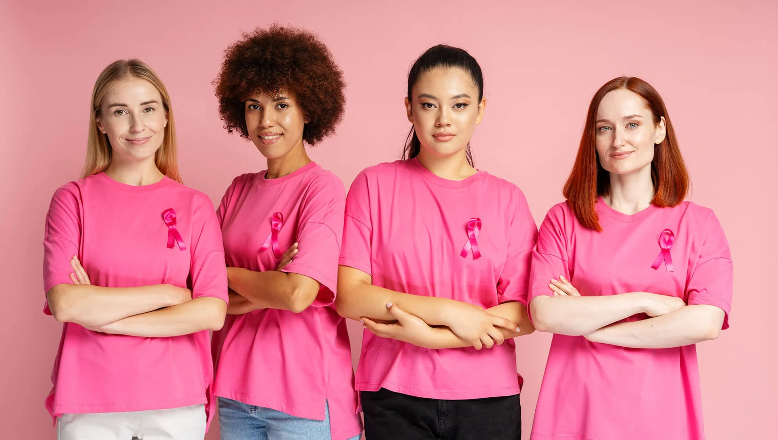Pink ribbon symbol with people supporting breast cancer awareness and prevention efforts.