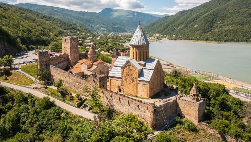 Scenic view of a Georgia travel destination with mountains, lakes, or cityscape, inviting viewers to plan their getaway.