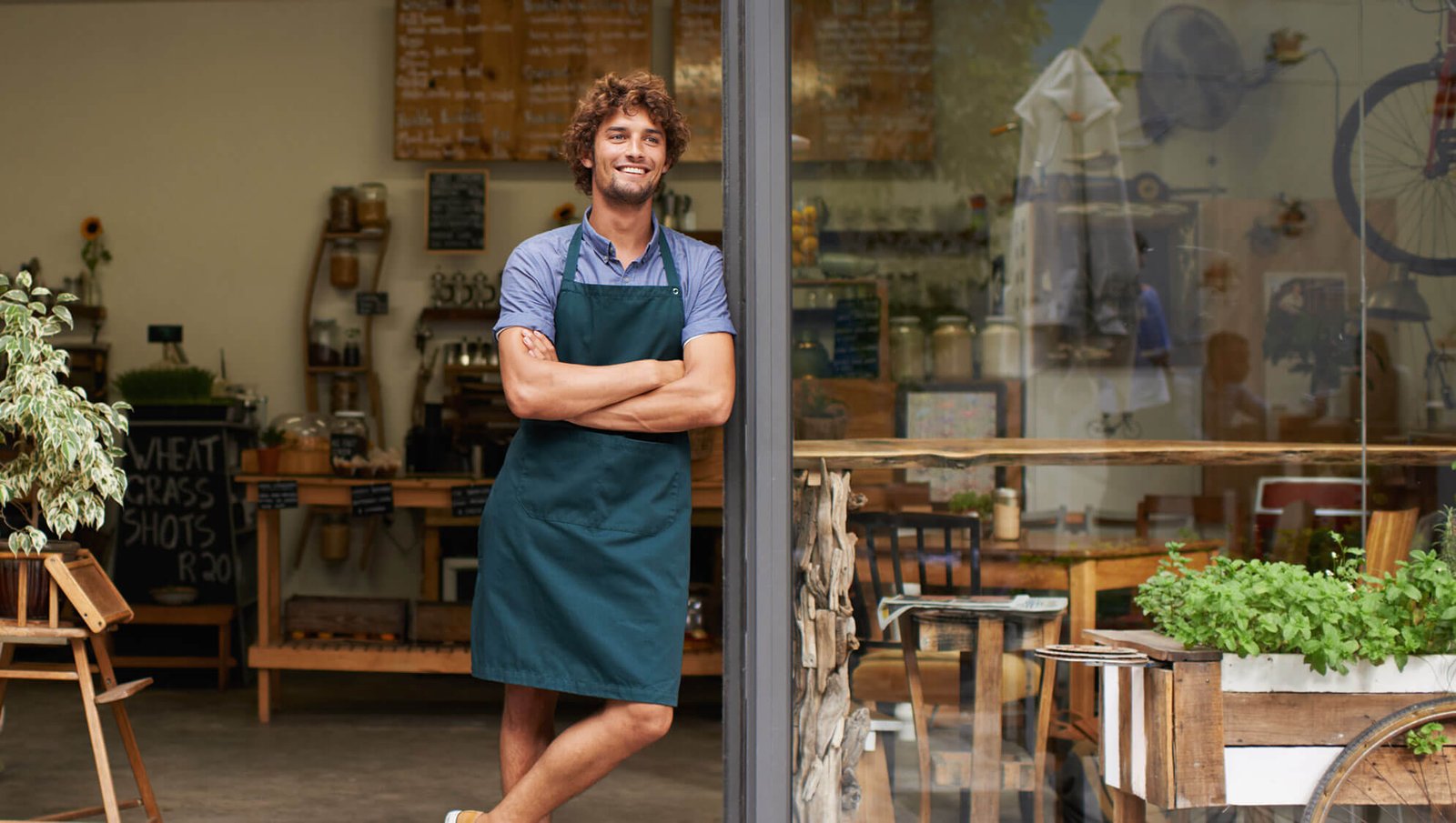 Young entrepreneur planning startup strategy at a desk, symbolizing small business opportunities for 2025.
