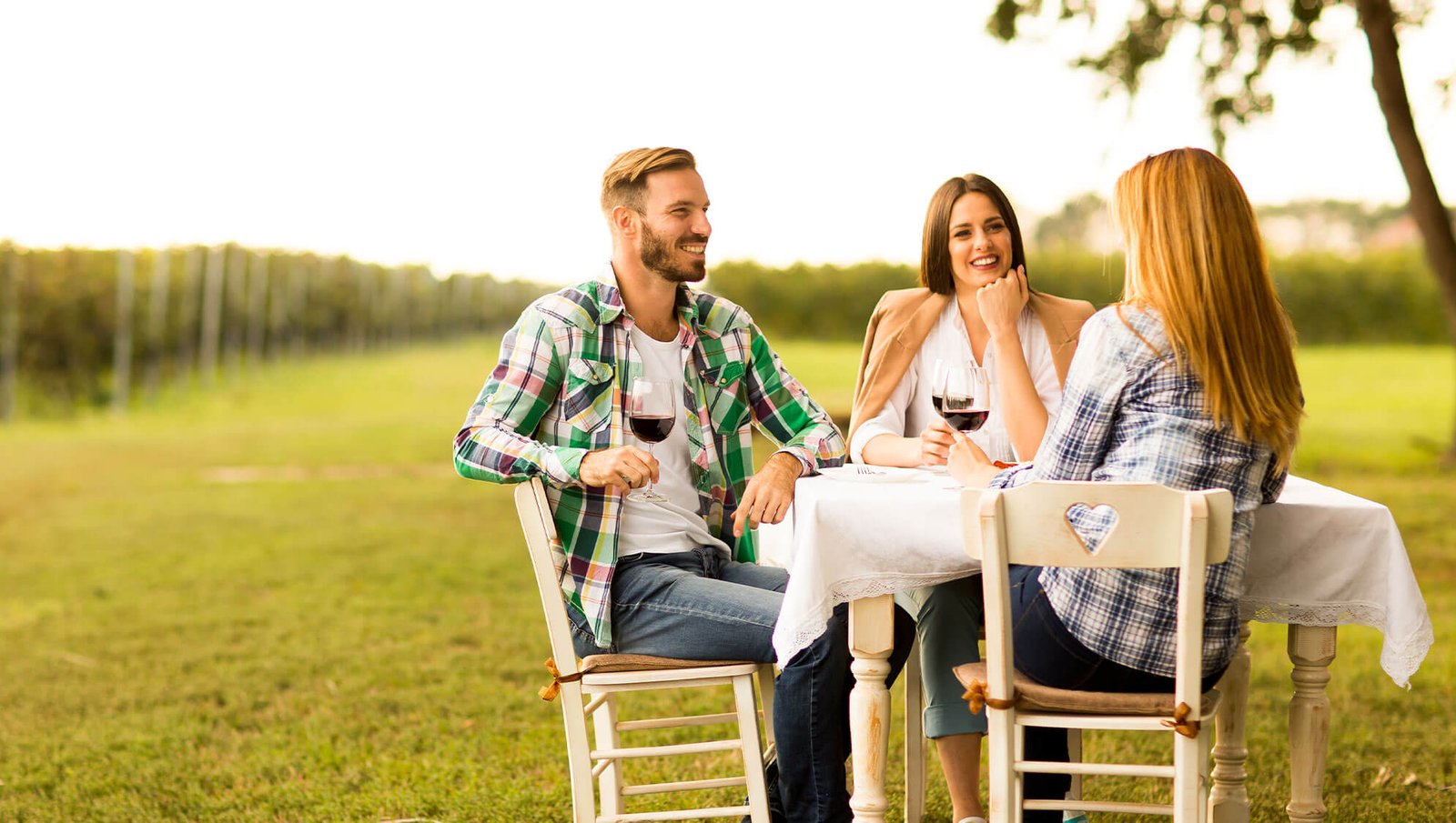 Scenic vineyard in Georgia with visitors enjoying wine tasting, highlighting the state’s best wineries and top vineyard experiences.