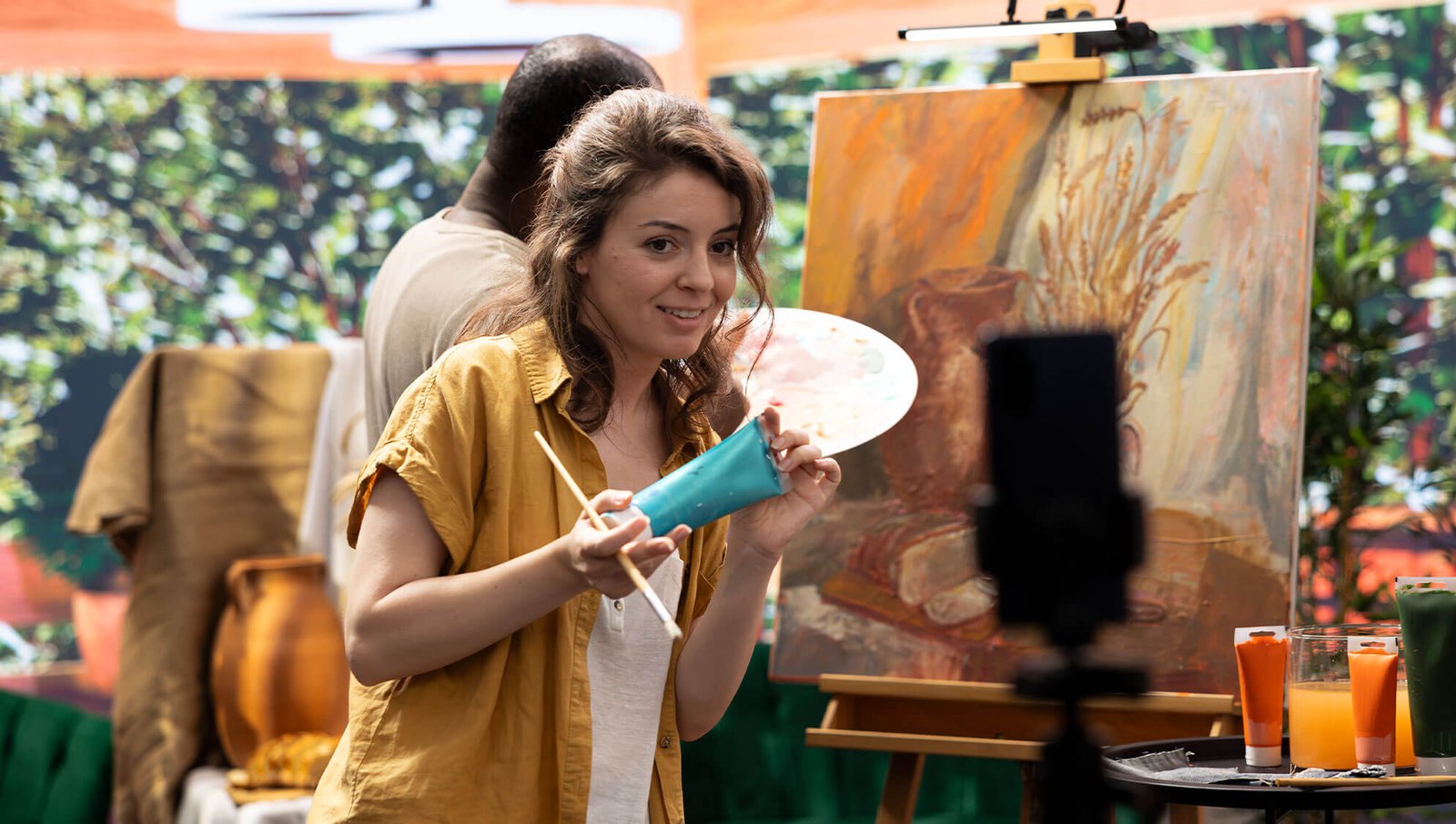 a woman is making her own video when she is making an art