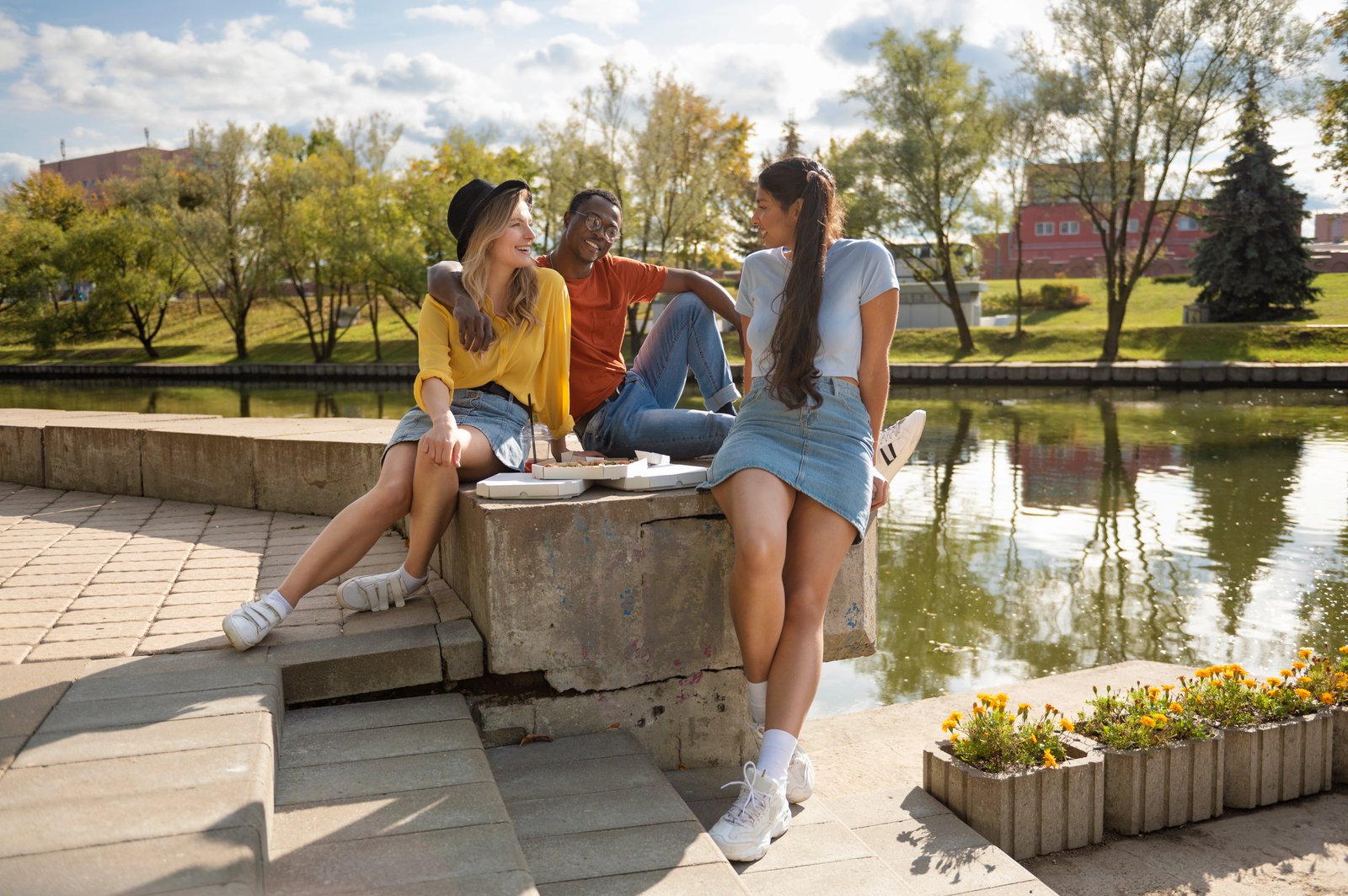 Visitors walking along a scenic trail in Piedmont Park, with the Atlanta skyline in the background, offering a peaceful escape into nature within the city.