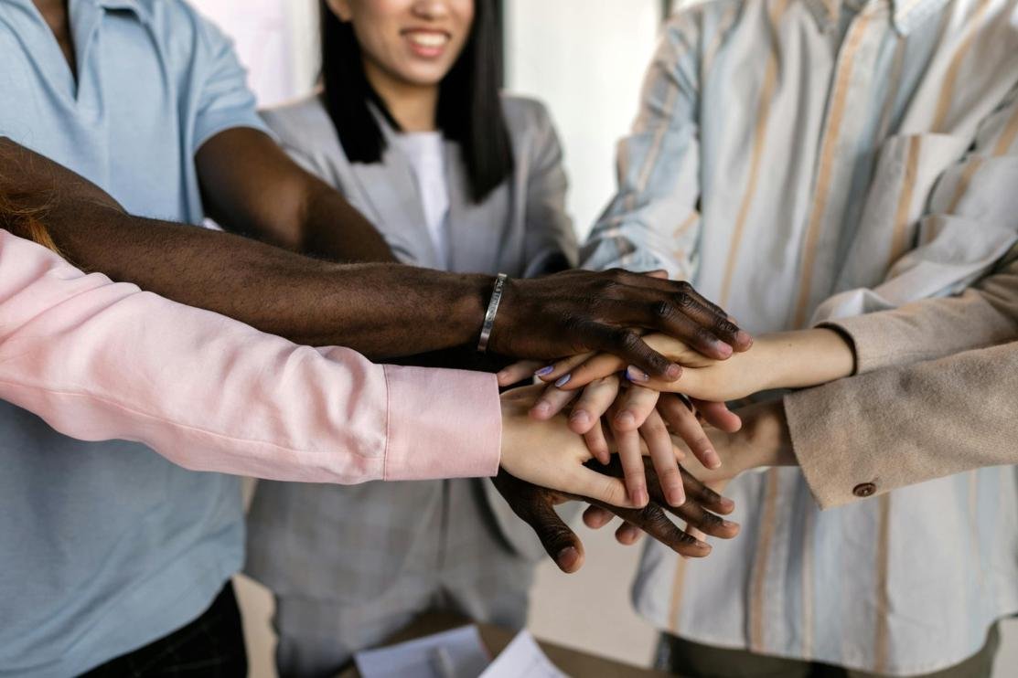 Diverse group of professionals collaborating in an Atlanta office, reflecting inclusive practices and representation in the city’s business community.