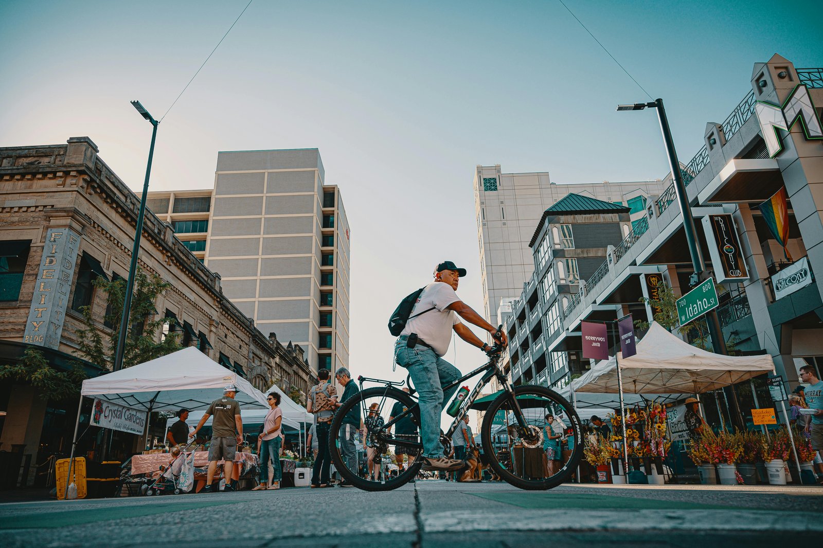 Shoppers browsing local goods at an outdoor market in Atlanta, featuring fresh produce, handmade crafts, and vibrant street vendor culture.